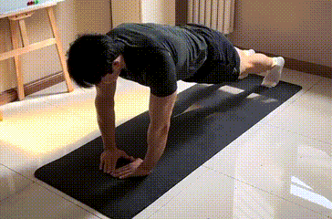 Man doing diamond push-up - inner chest exercise at home