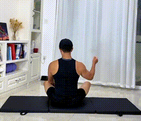 Person Stretching Triceps After Beginner Arm Workout At Home Without Equipment