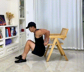 Beginner Doing Chair Triceps Dips In No-Equipment Arm Workout At Home