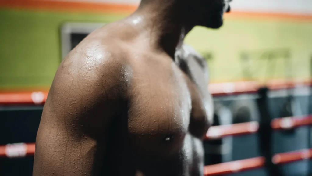Close-up of shoulder muscles for bodyweight shoulder exercises.