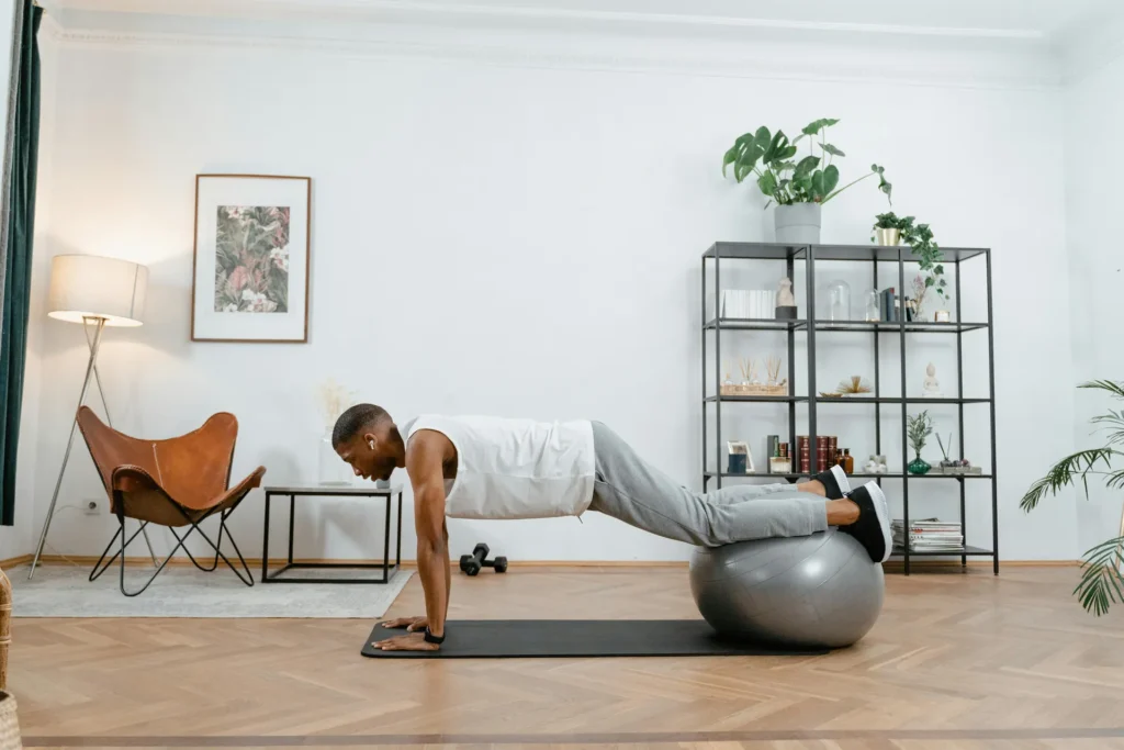 Man performing a decline push-up at home for an Upper Chest Workout.