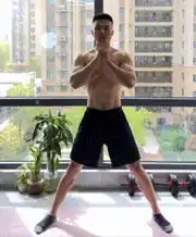 Man moves from a lateral lunge to a reverse lunge in a bodyweight leg workout.