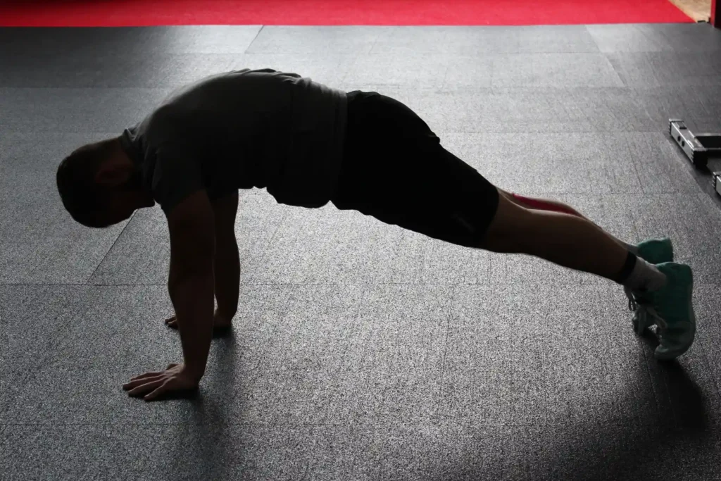 Man performing Push-Up Plus to target serratus anterior exercises