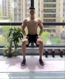 Man doing seated calf raise in a beginner leg workout