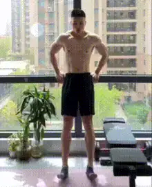 Man lifts his toes while standing for home leg exercises.