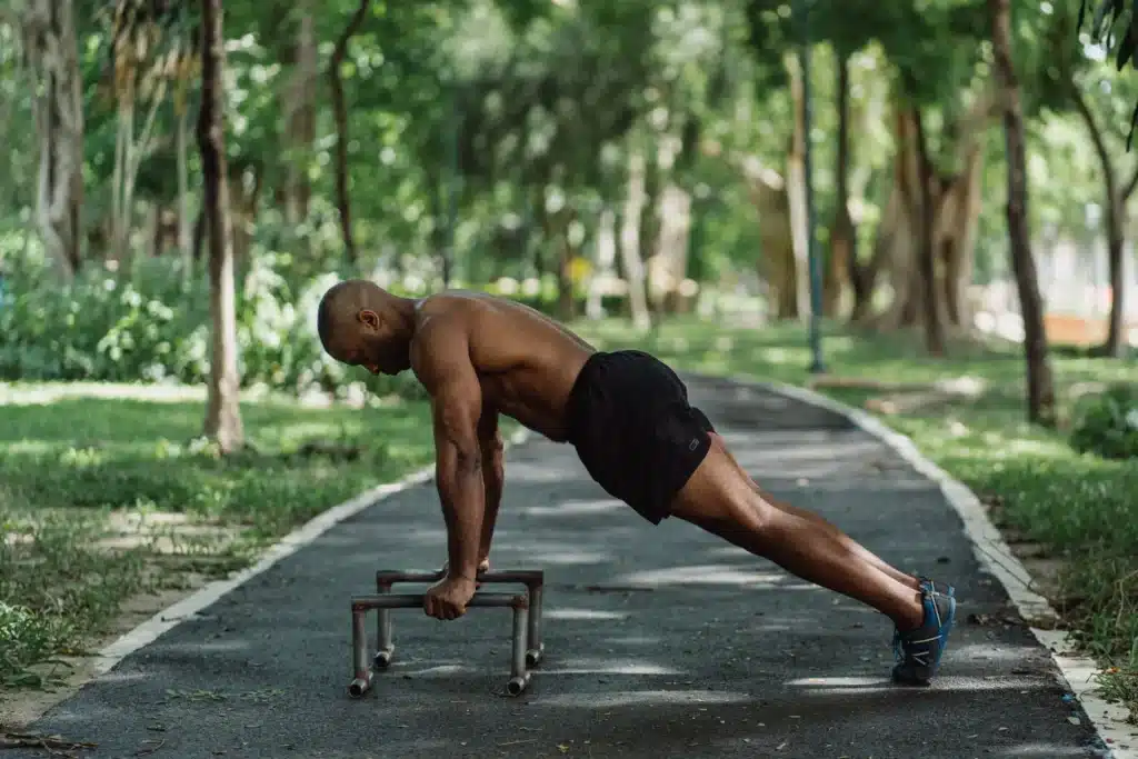 A man doing incline push-ups