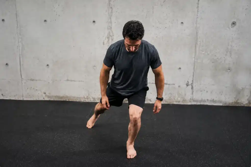 Man performing Single-Leg Balance with Lateral Reach, one type of Fibularis Group Exercises