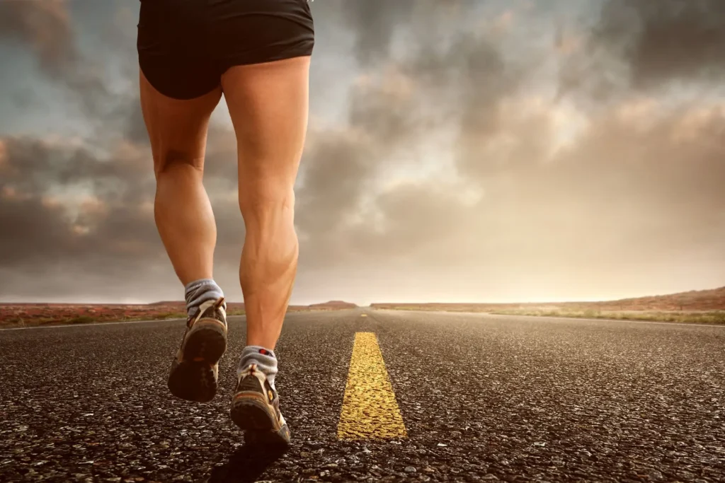 Well-developed human calves while road running, showing functional benefits gained from regular soleus exercises